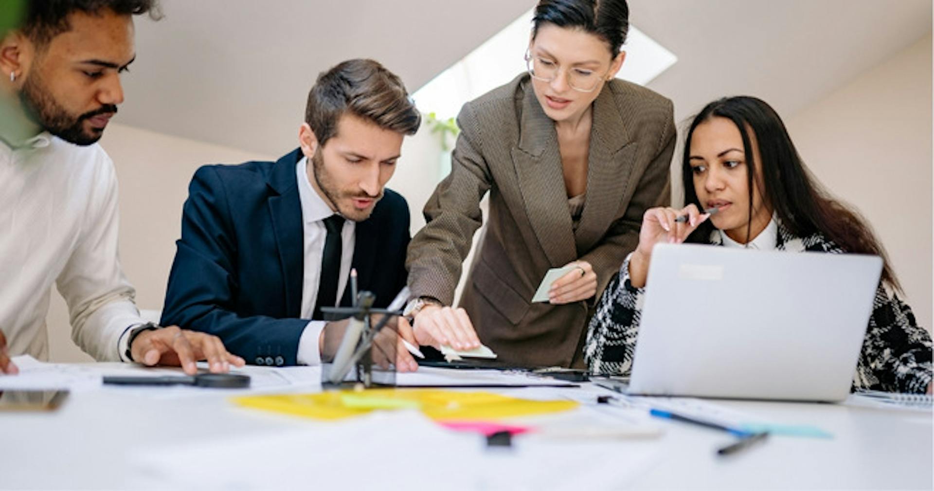 A group of employees researching and brainstorming ideas together