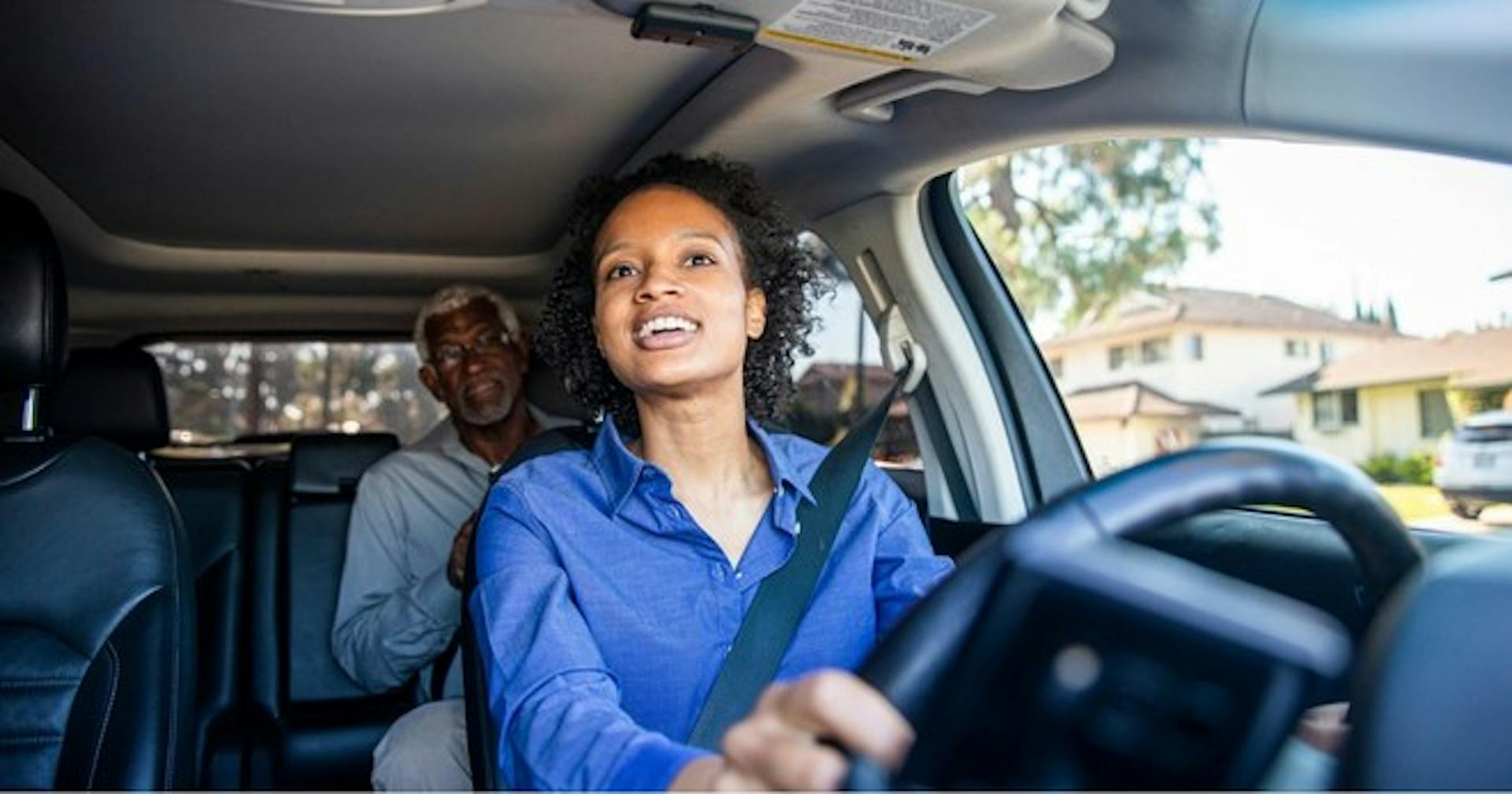 A woman applying explicit knowledge by driving a car