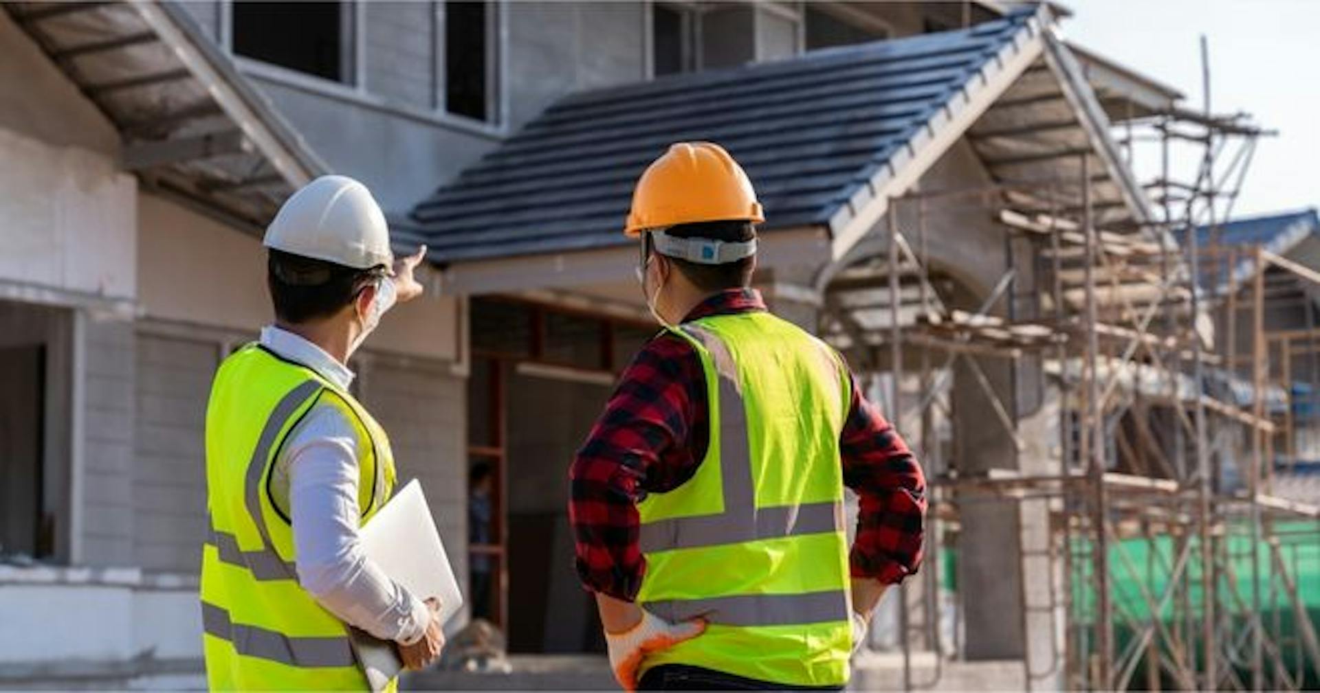 Two guys discussing the importance of construction skills.