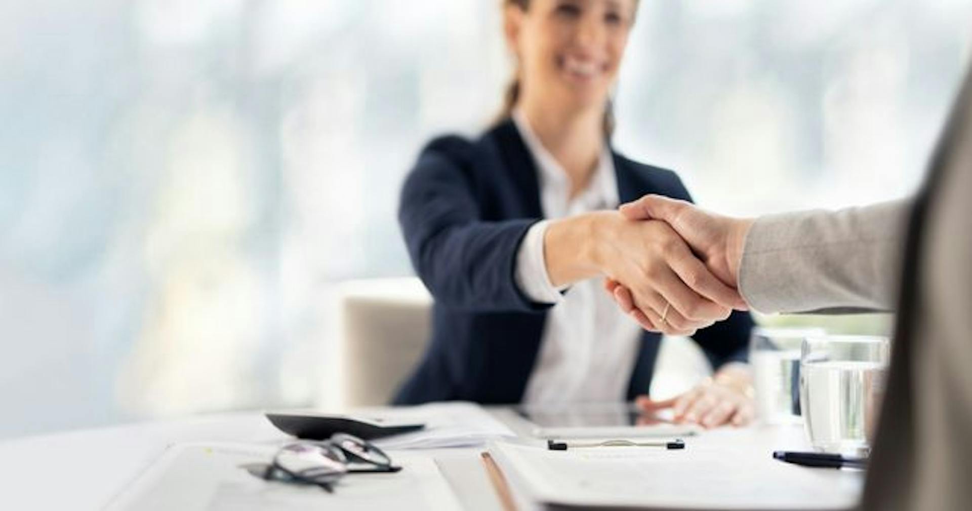 woman successfully negotiating with another person