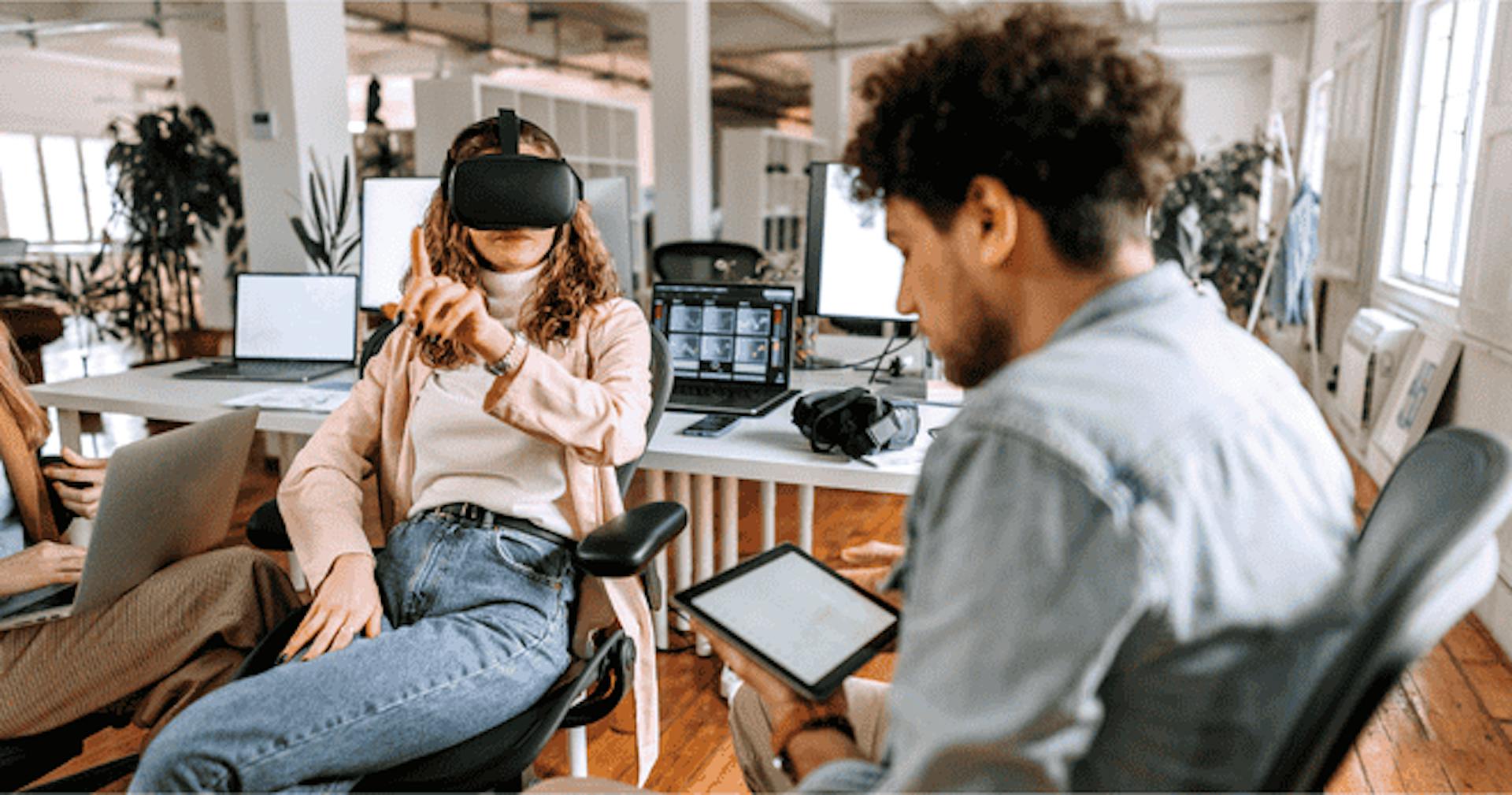 Workers using VR and a tablet for training