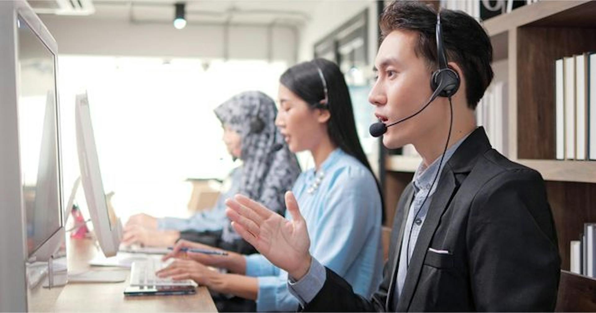 man communicating with a customer through a call