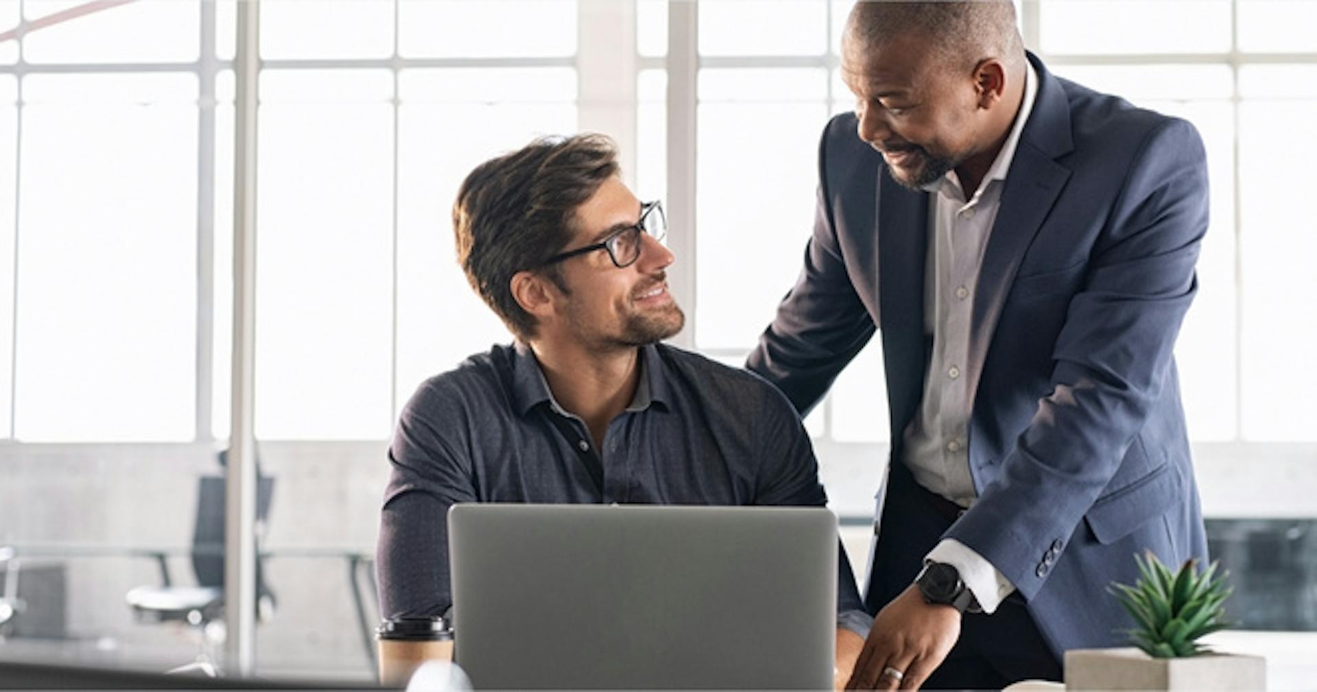 Boss giving positive feedback to employee