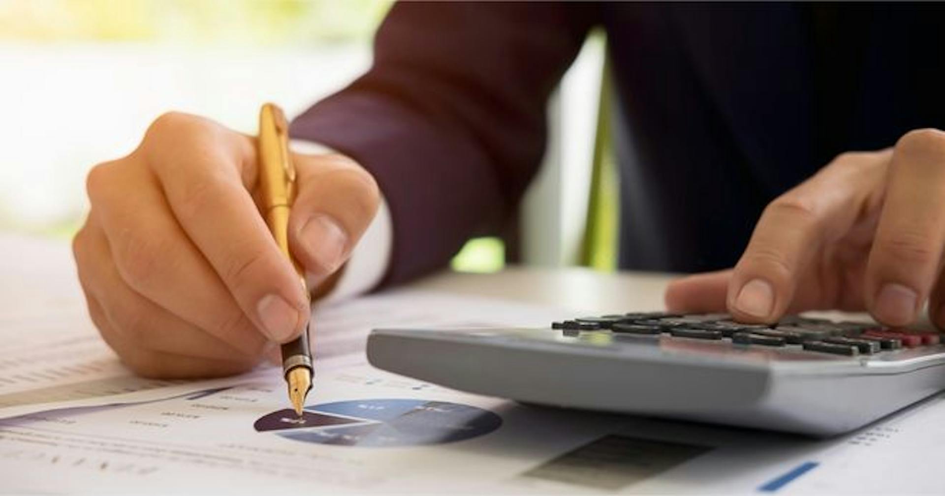 manager calculating costs of construction project