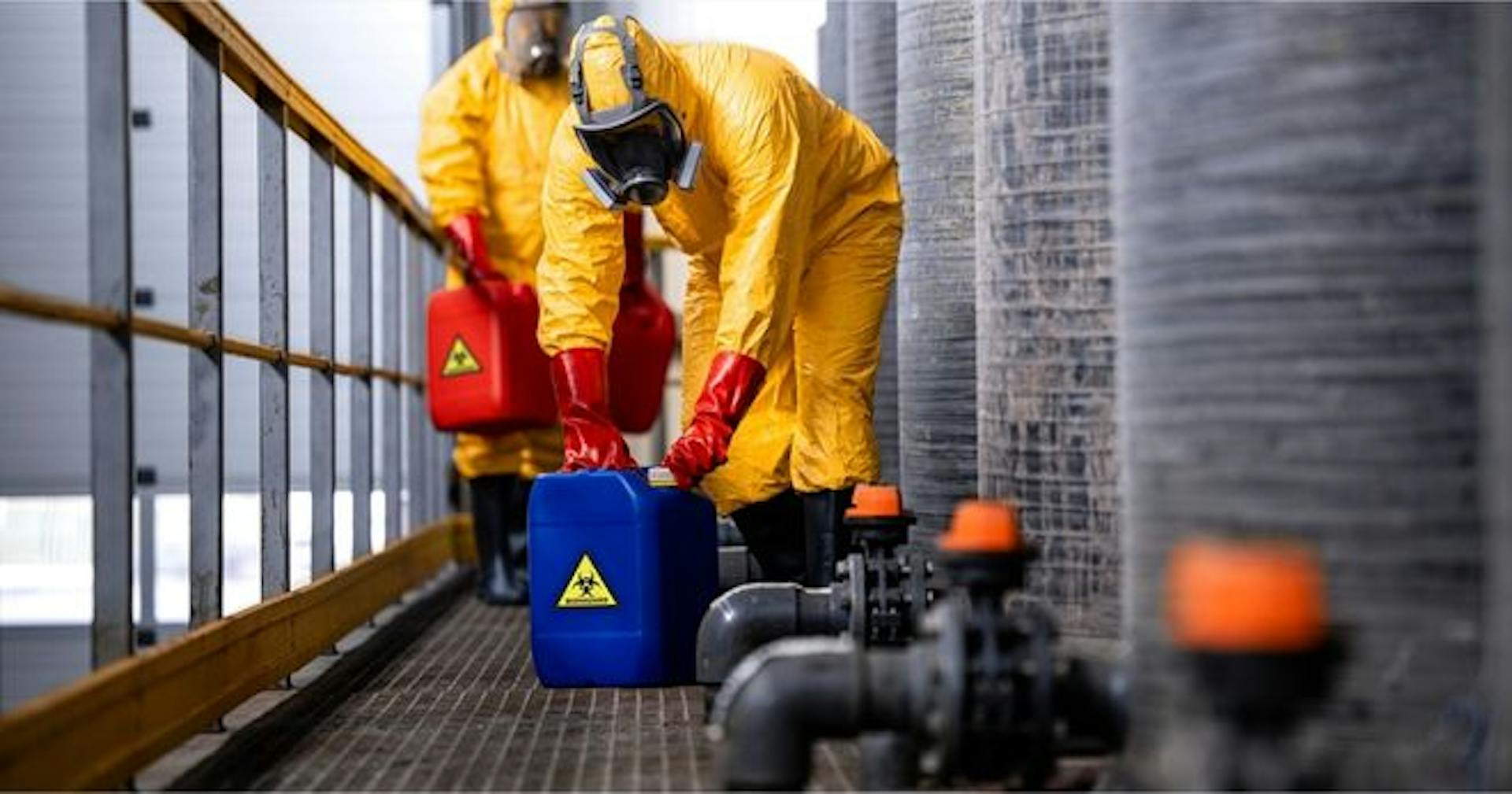 employees practicing proper handling of hazardous materials