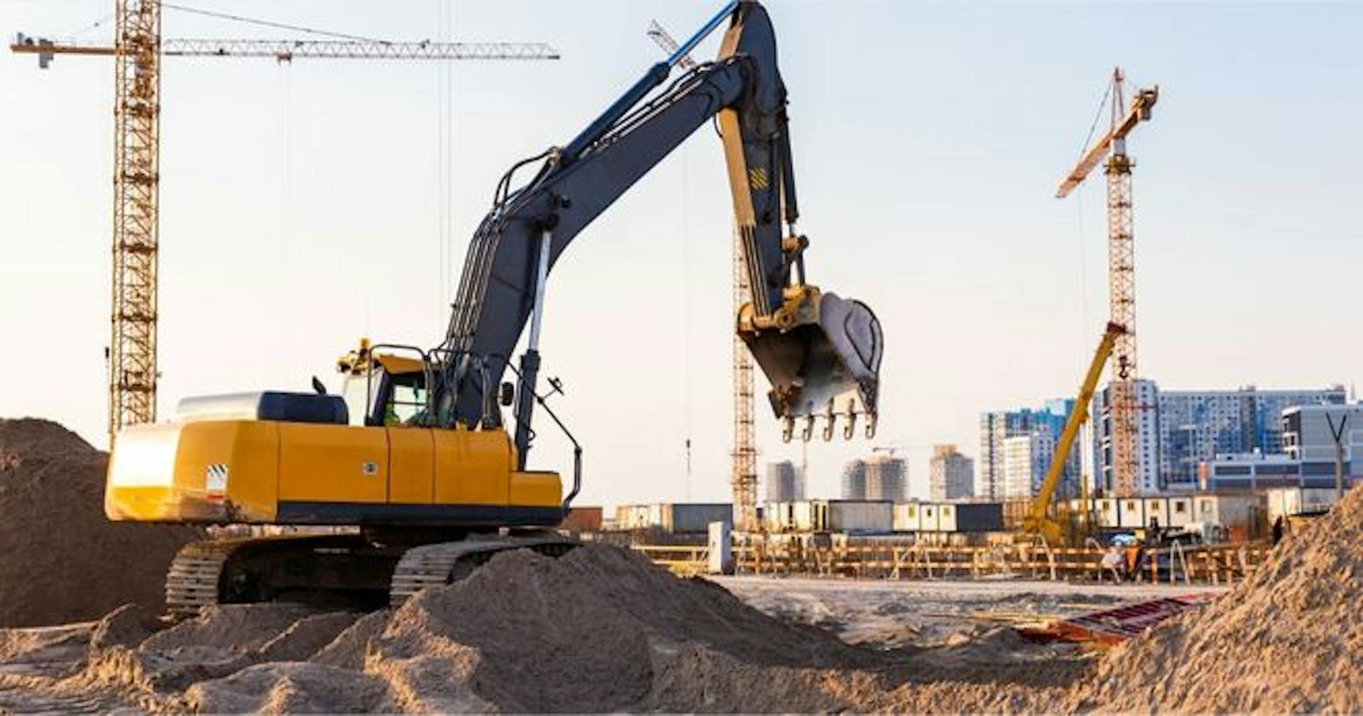 employee operating construction vehicle at work
