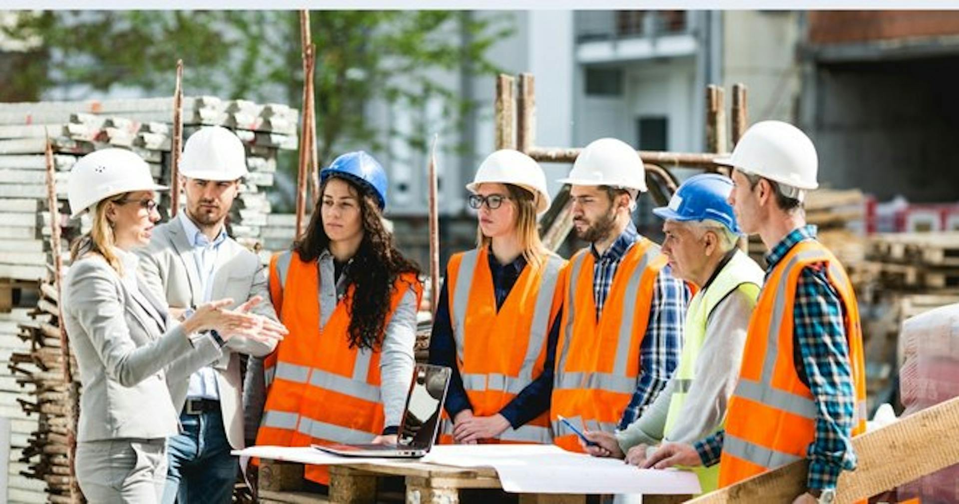 A mock meeting between construction crew members as a communication training activity