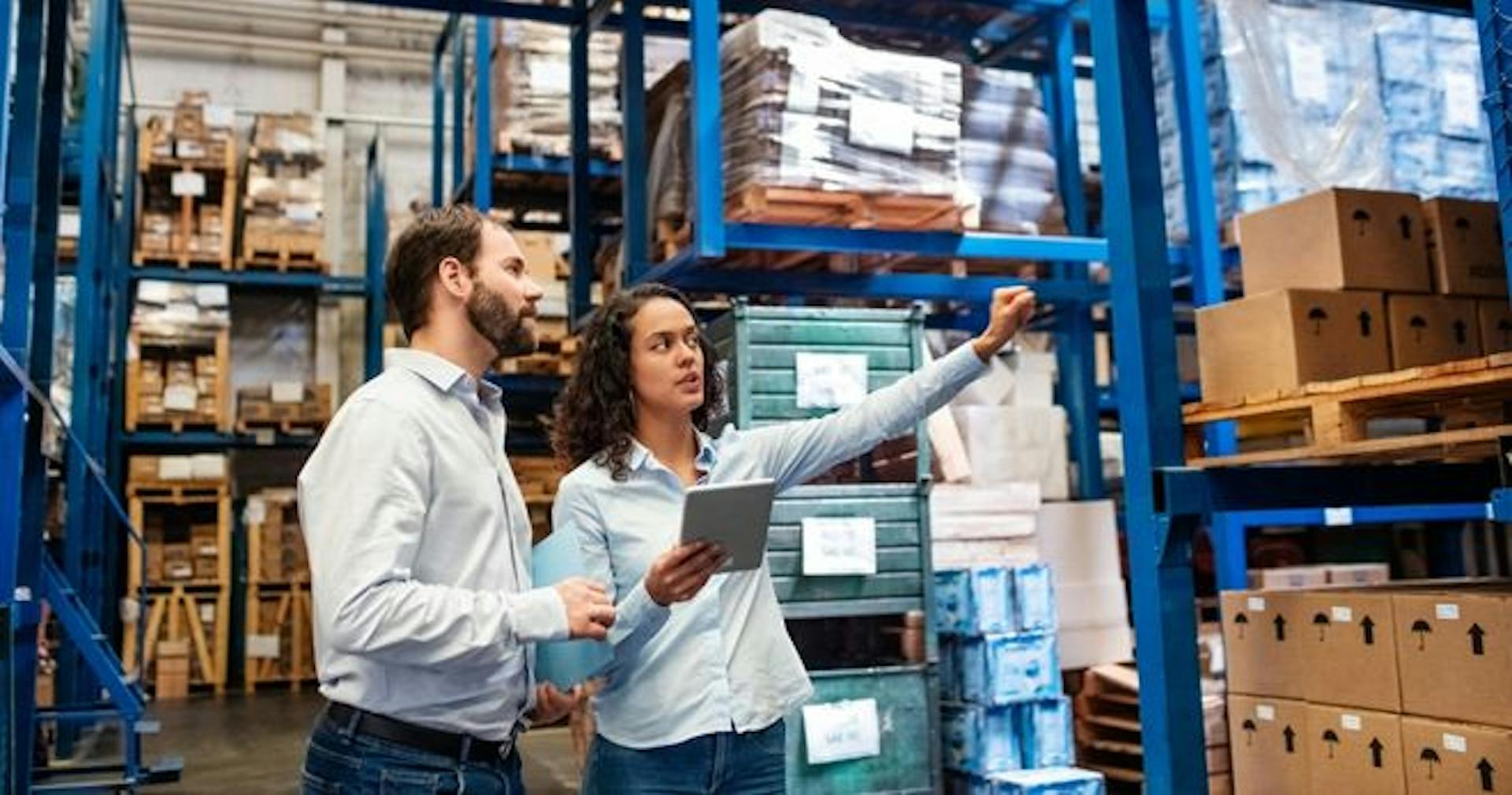 Logistics workers reviewing inventory