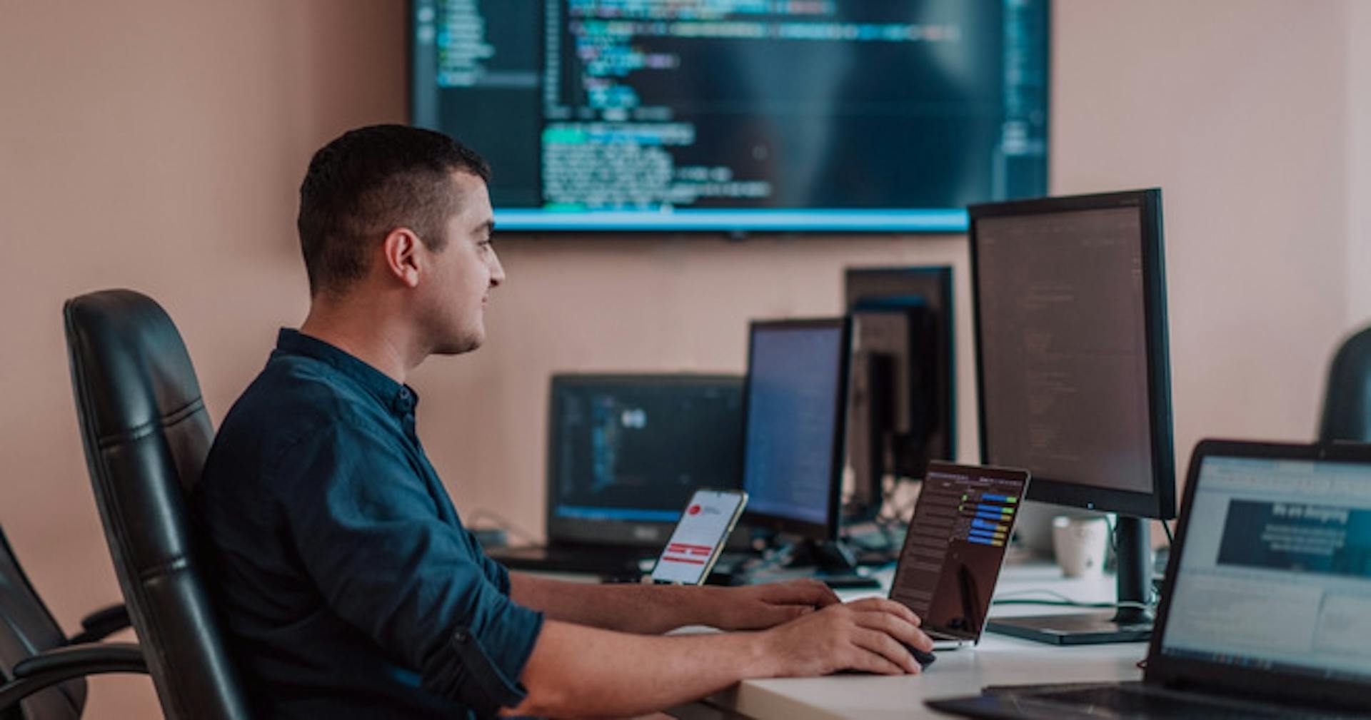 A man studying financial literacy on his desktop
