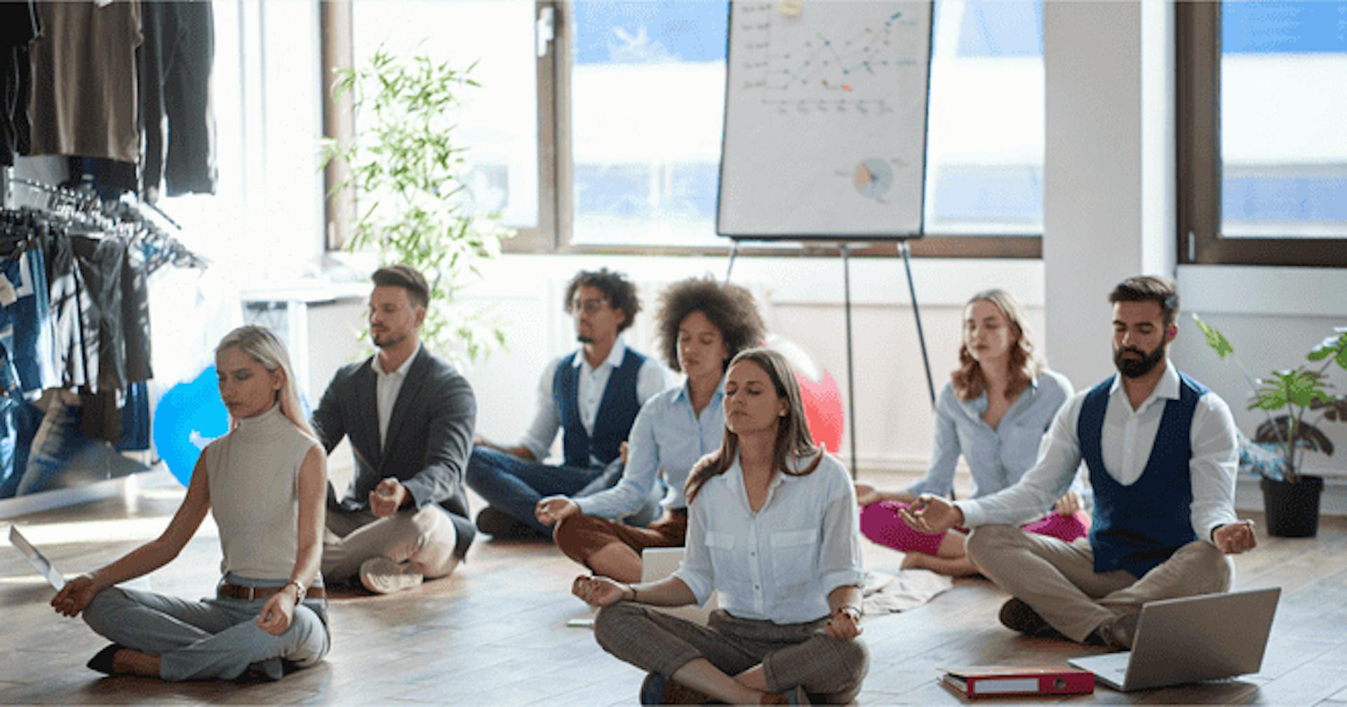 Employees meditating in the office