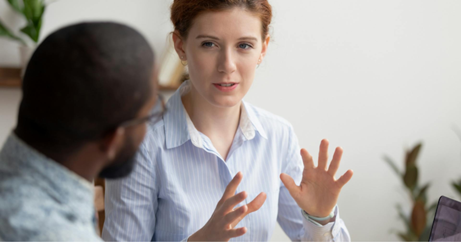 A person explaining something to someone else