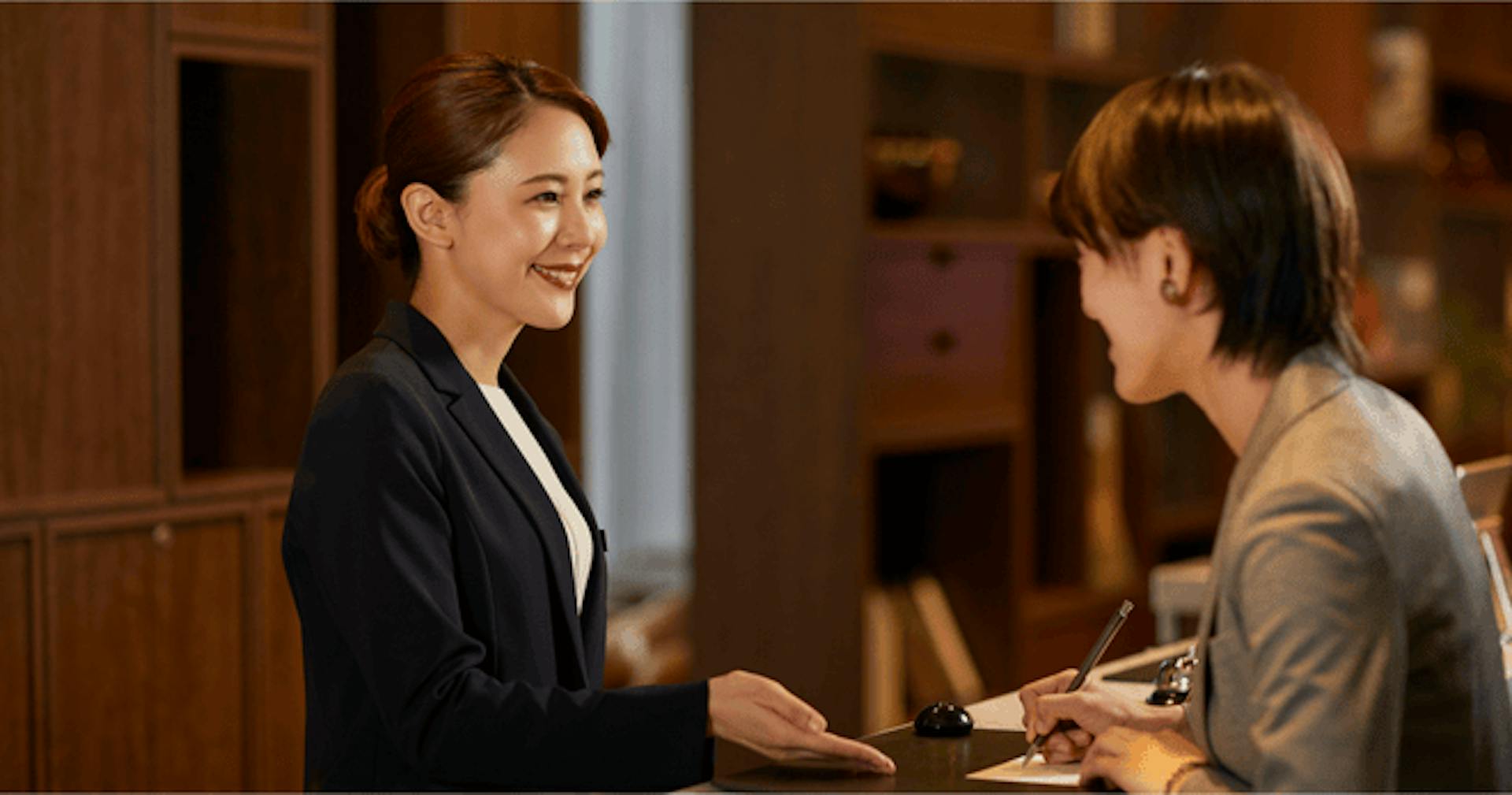 Receptionist assisting a guest