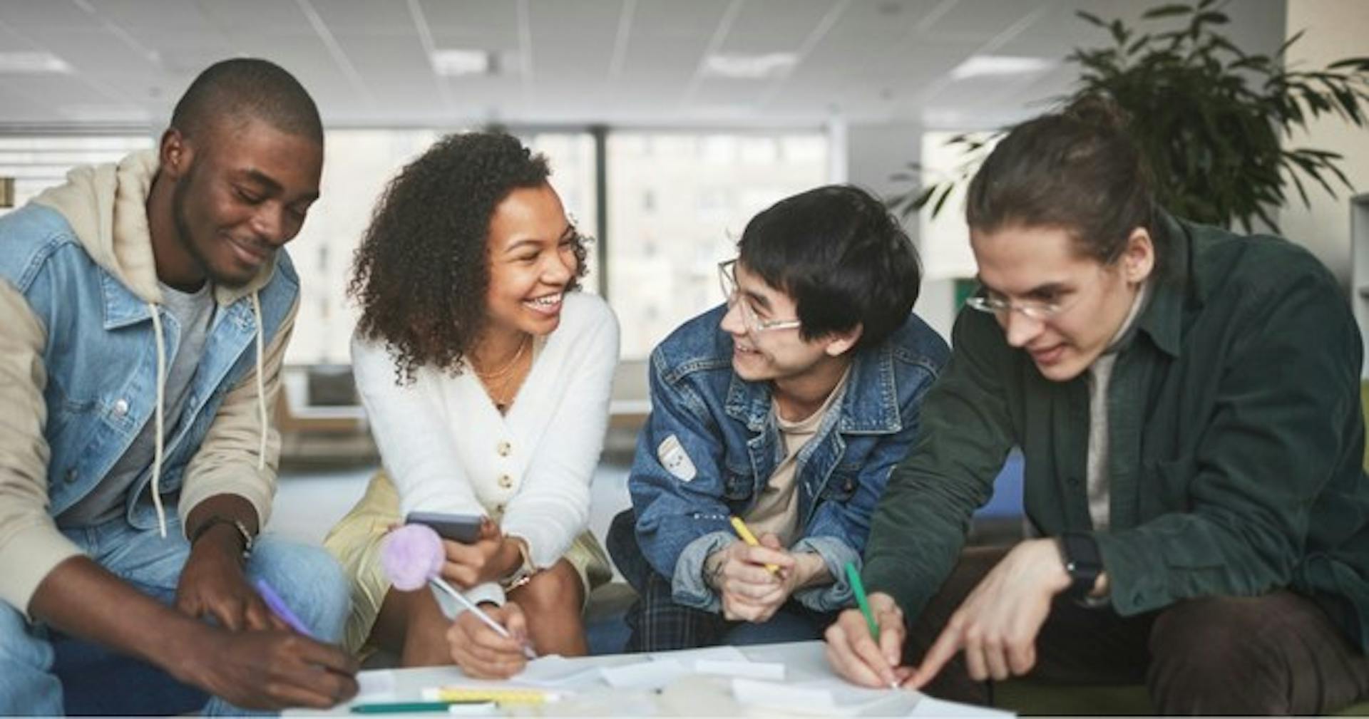 A team studying product training modules