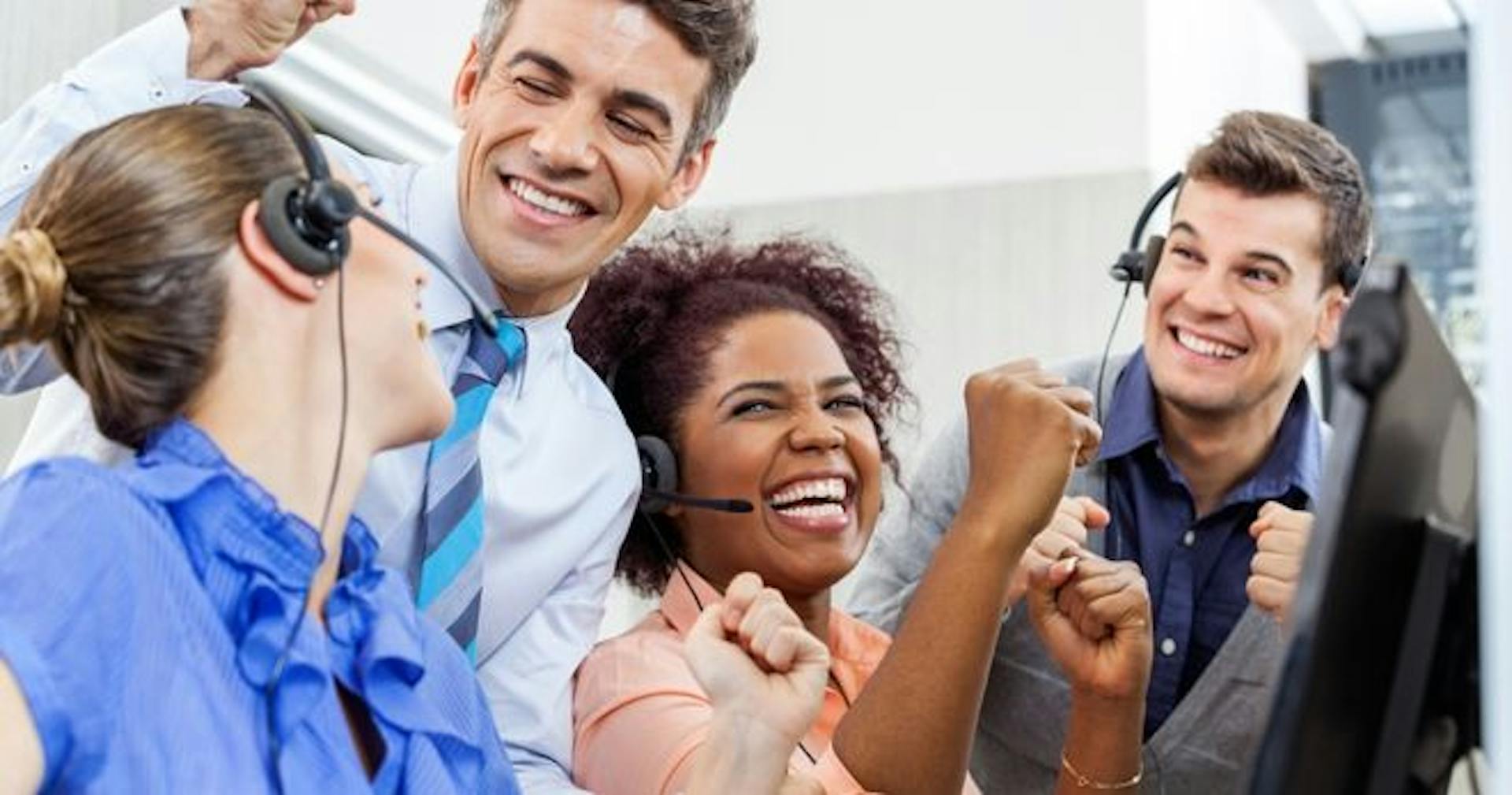 A team rejoicing over closing a deal 