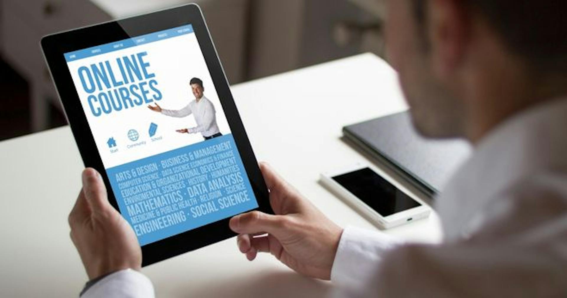 An employee viewing a course outline on a tablet