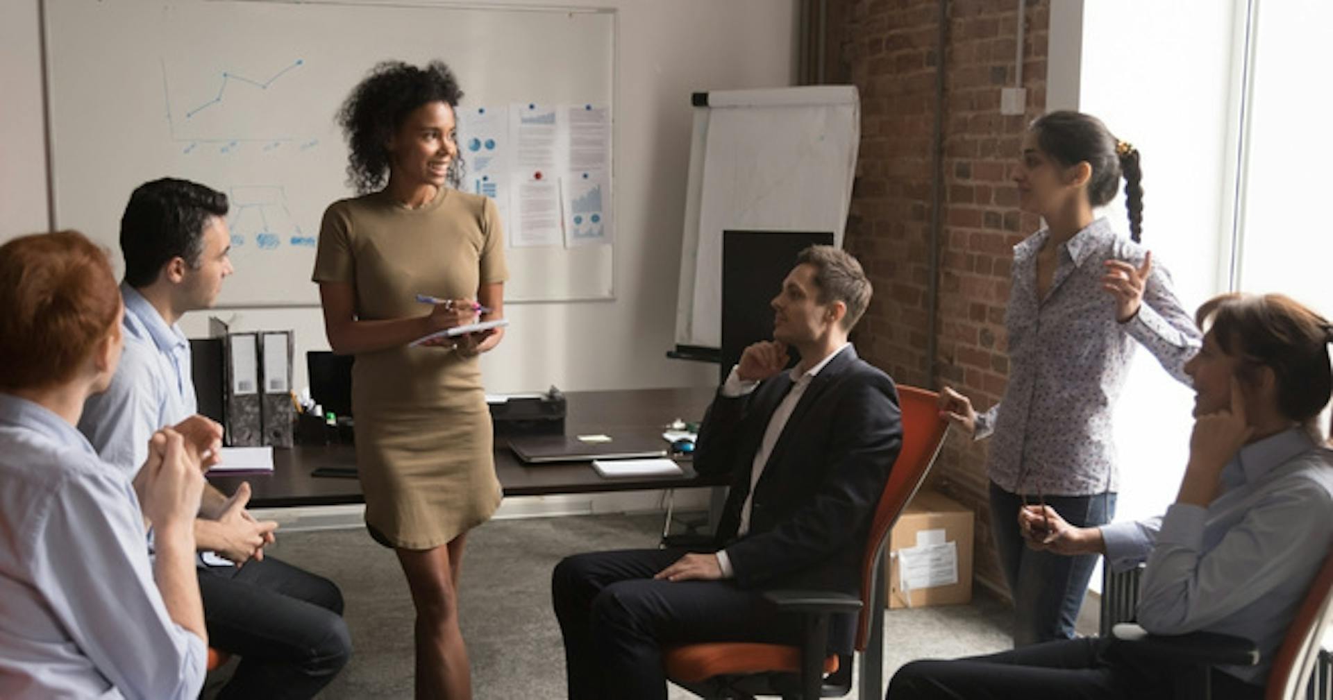 A leader talking to her team