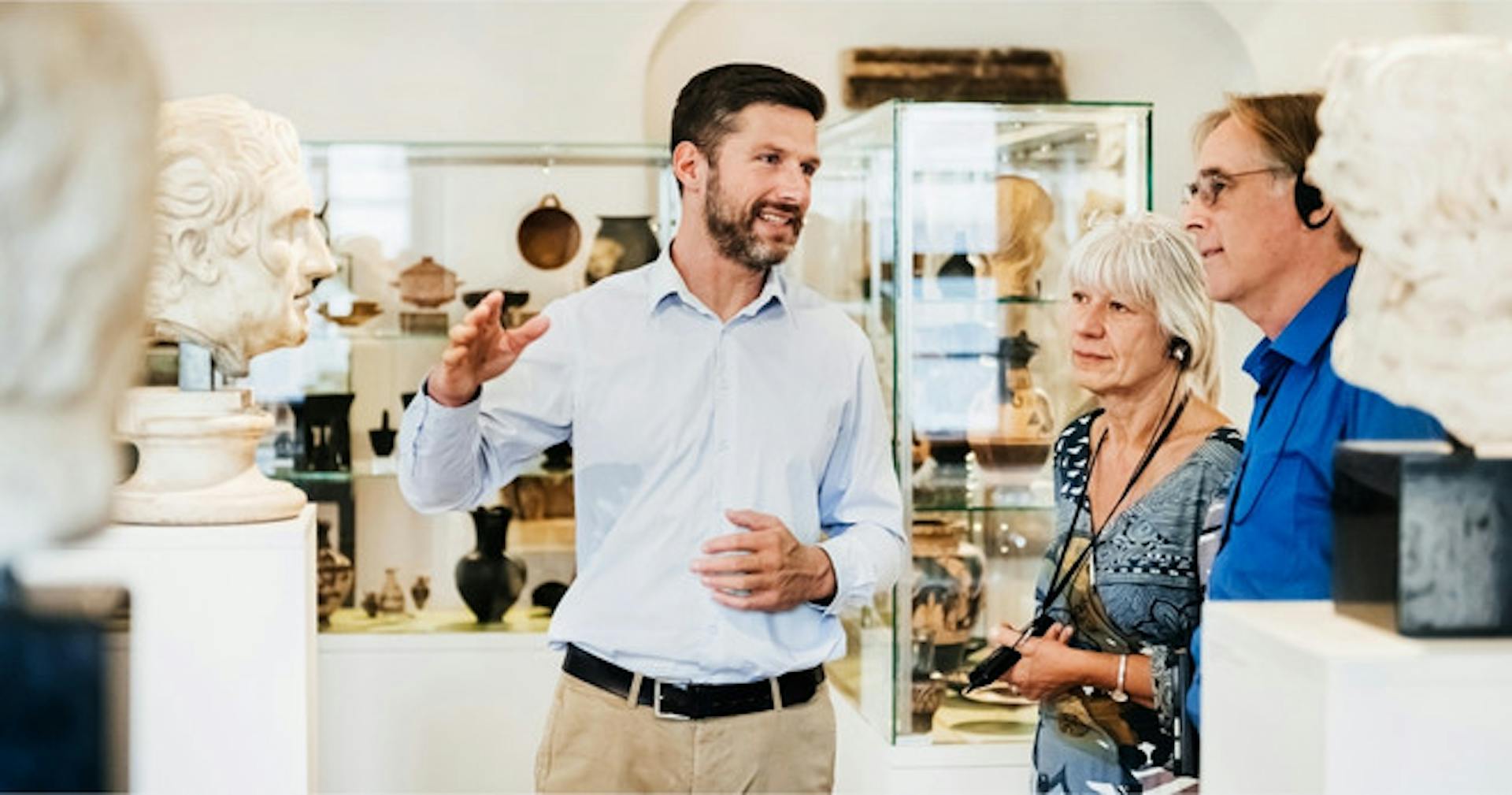 Tour guide explaining an exhibit