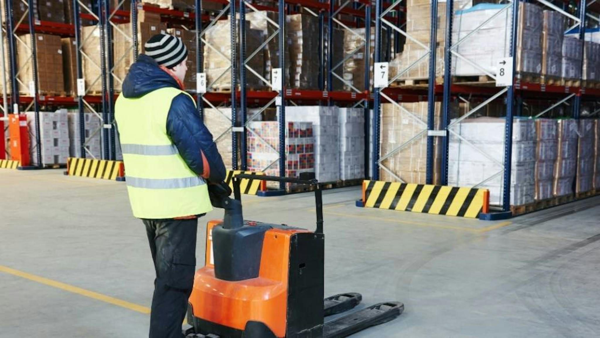 A pallet stacker operator in the warehouse