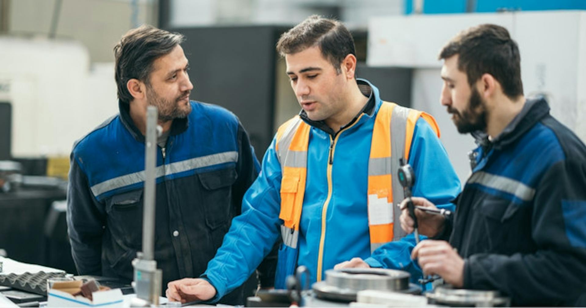 Industrial managers reviewing their procedures