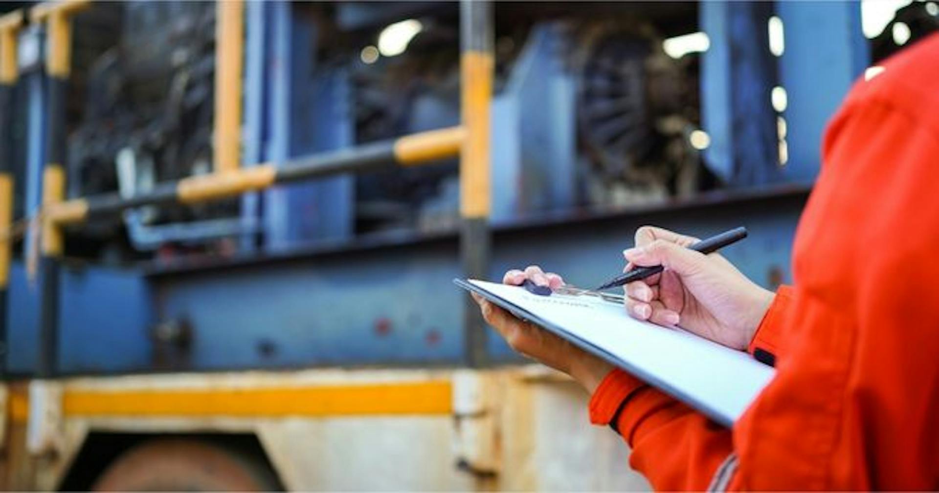 Person conducting preventative maintenance on equipment
