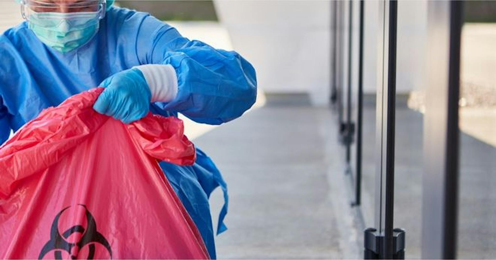 Worker safely disposing of hazardous waste