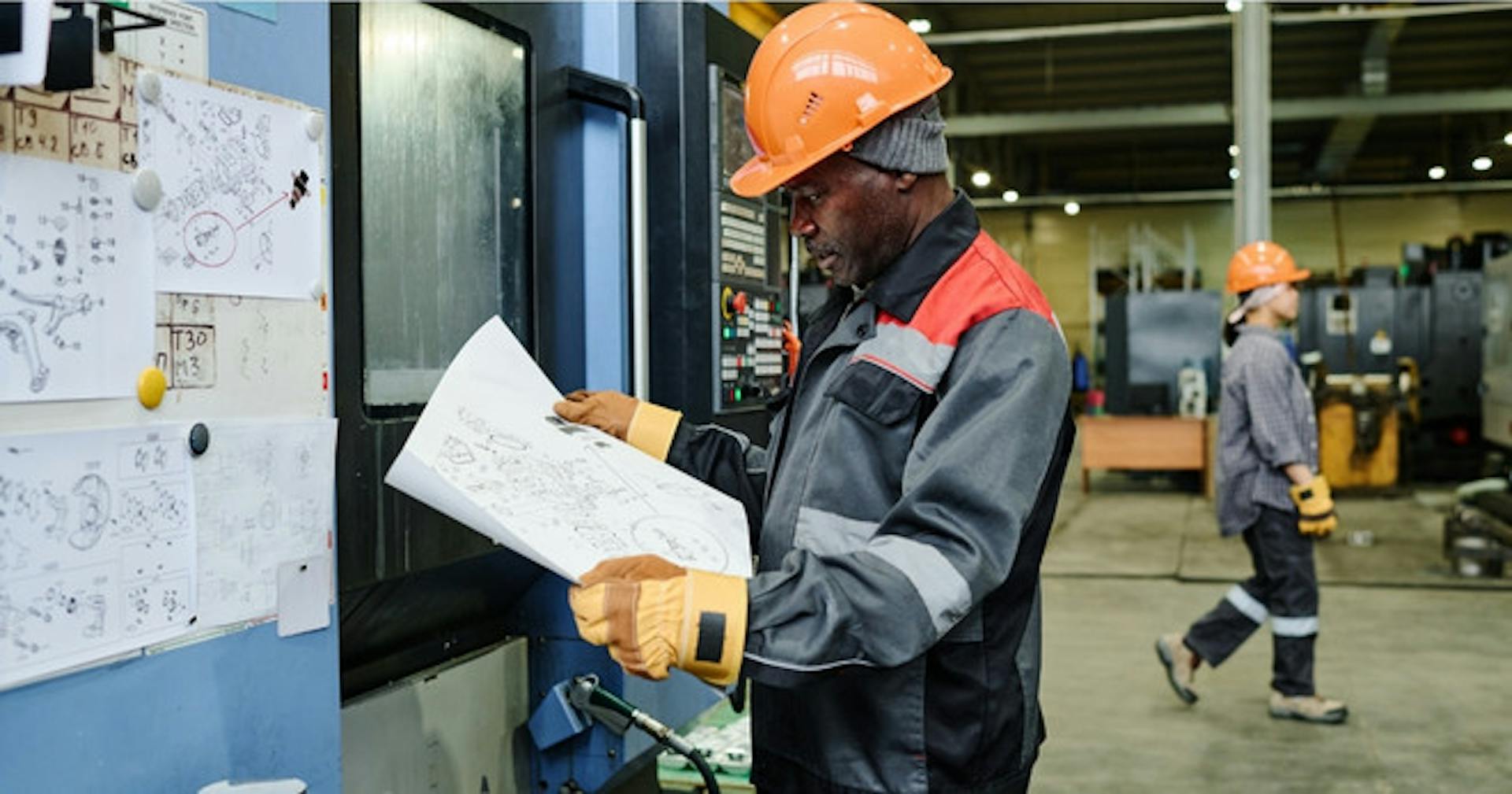 Shop worker analyzing graphs