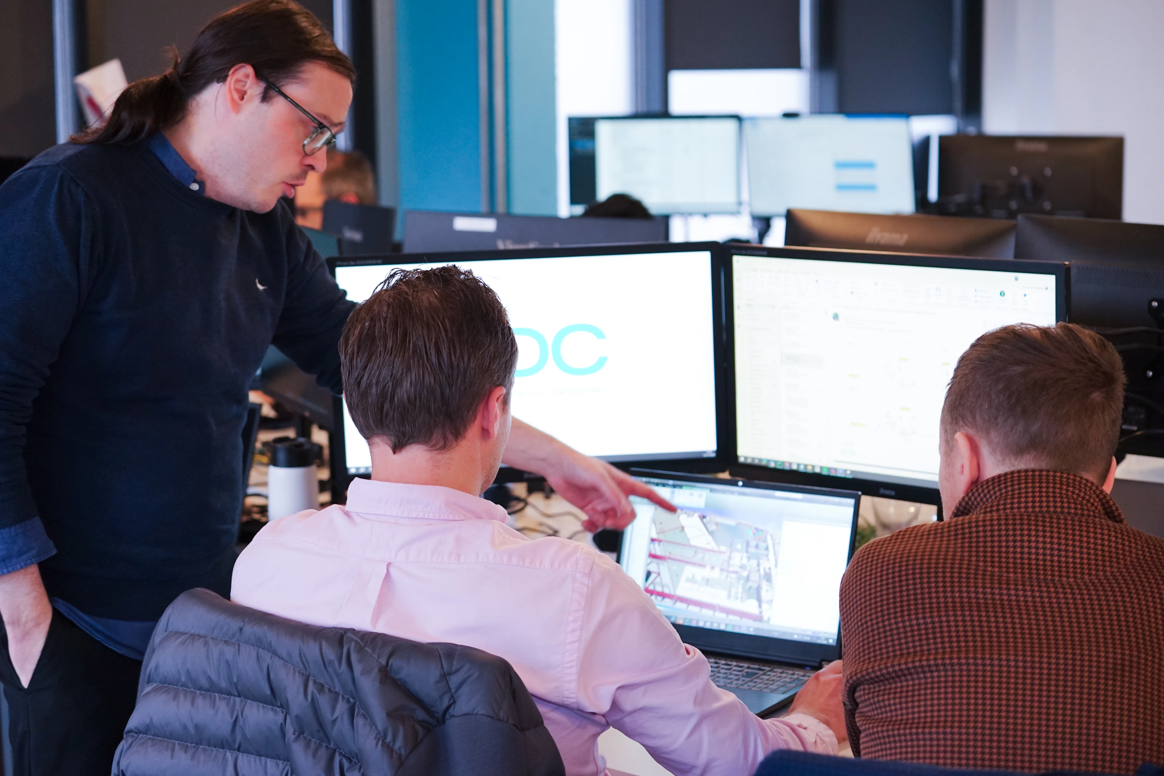 Engineers reviewing designs for lessons learned