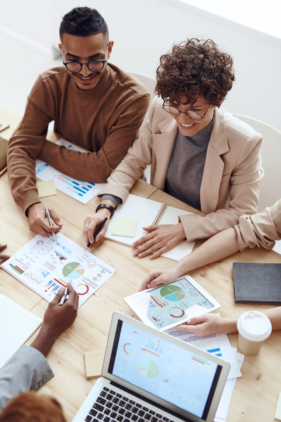 Professionals reviewing documents during a business meeting