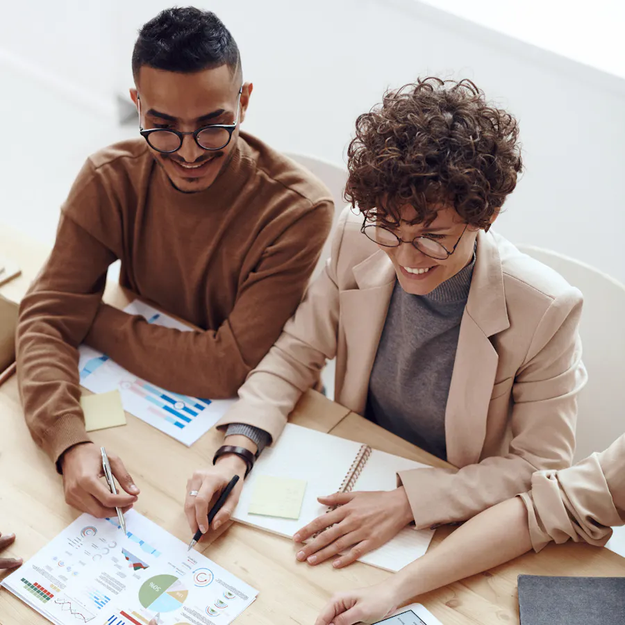 Professionals reviewing documents during a business meeting