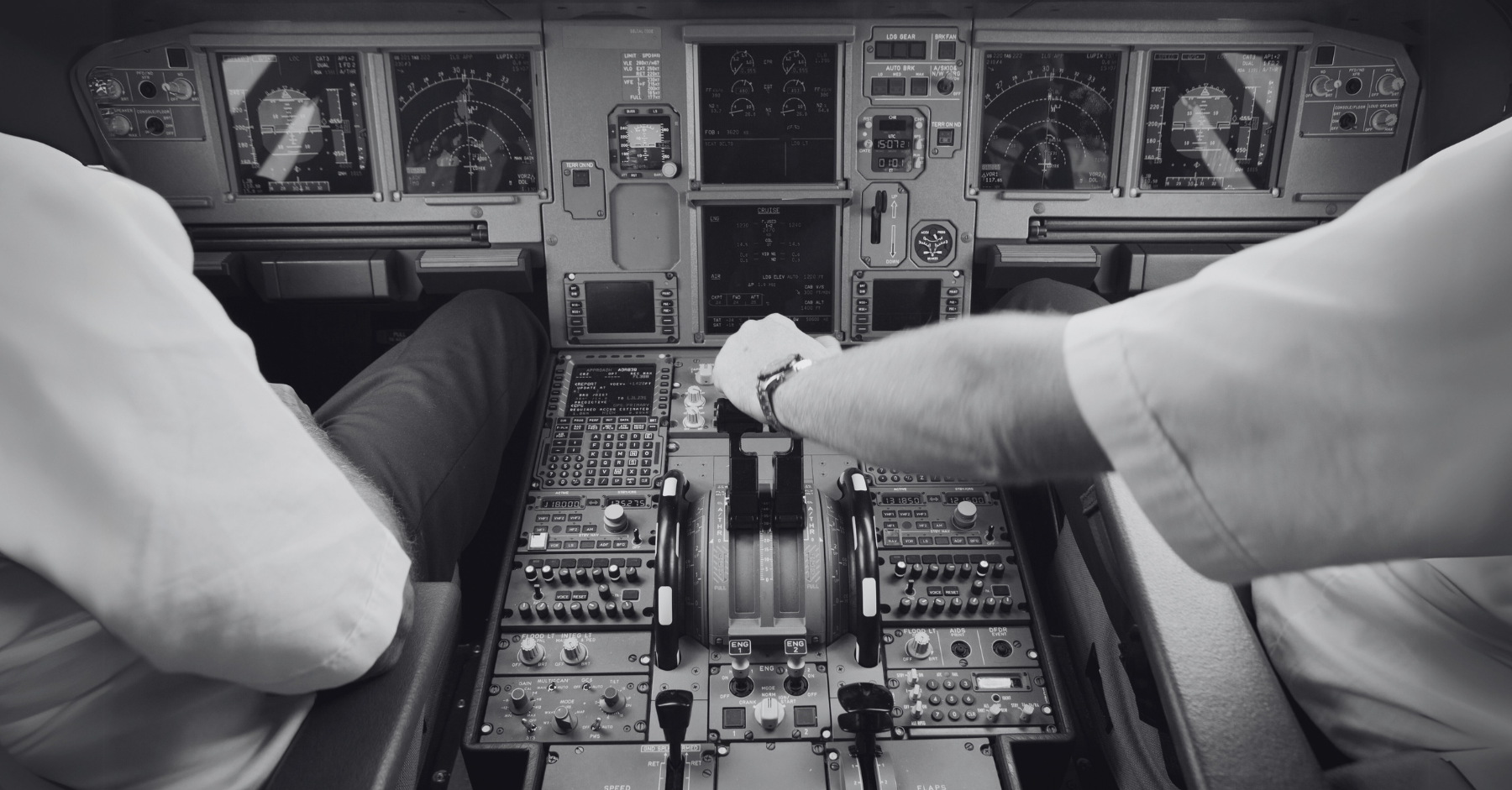 Cockpit with two pilots at work in a large airplane