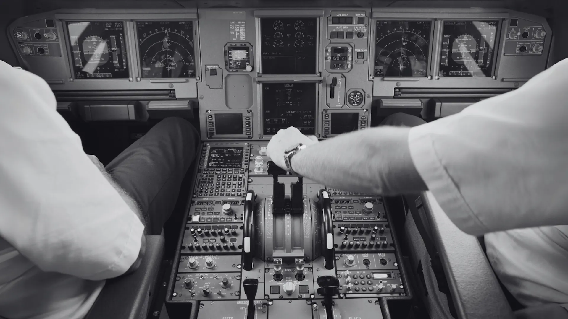 Cockpit with two pilots at work in a large airplane Cockpit with two pilots at work in a large airplane