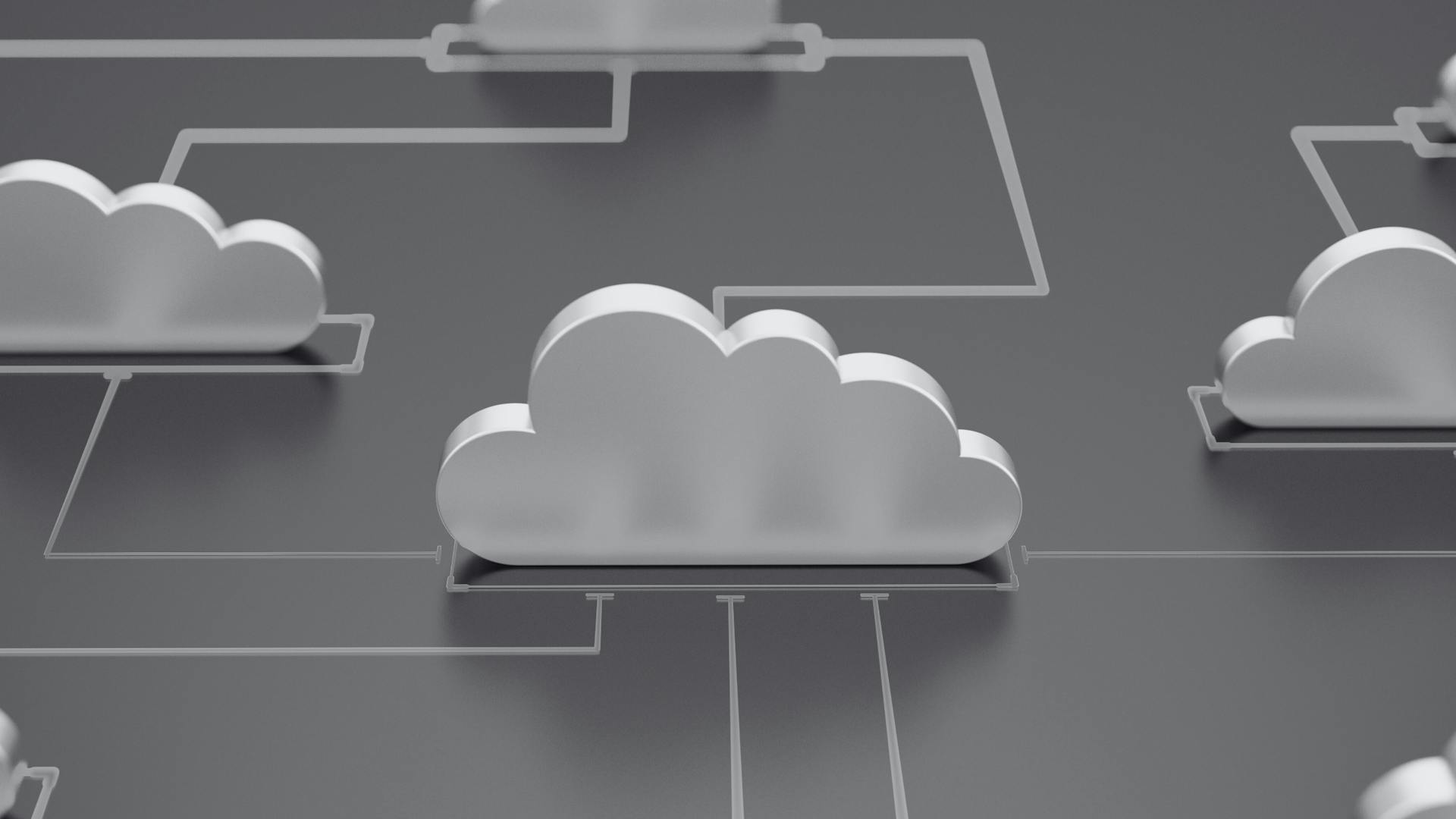 A 3D illustration of multiple cloud icons connected by thin light lines on a dark ground. A 3D illustration of multiple cloud icons connected by thin light lines on a dark ground.