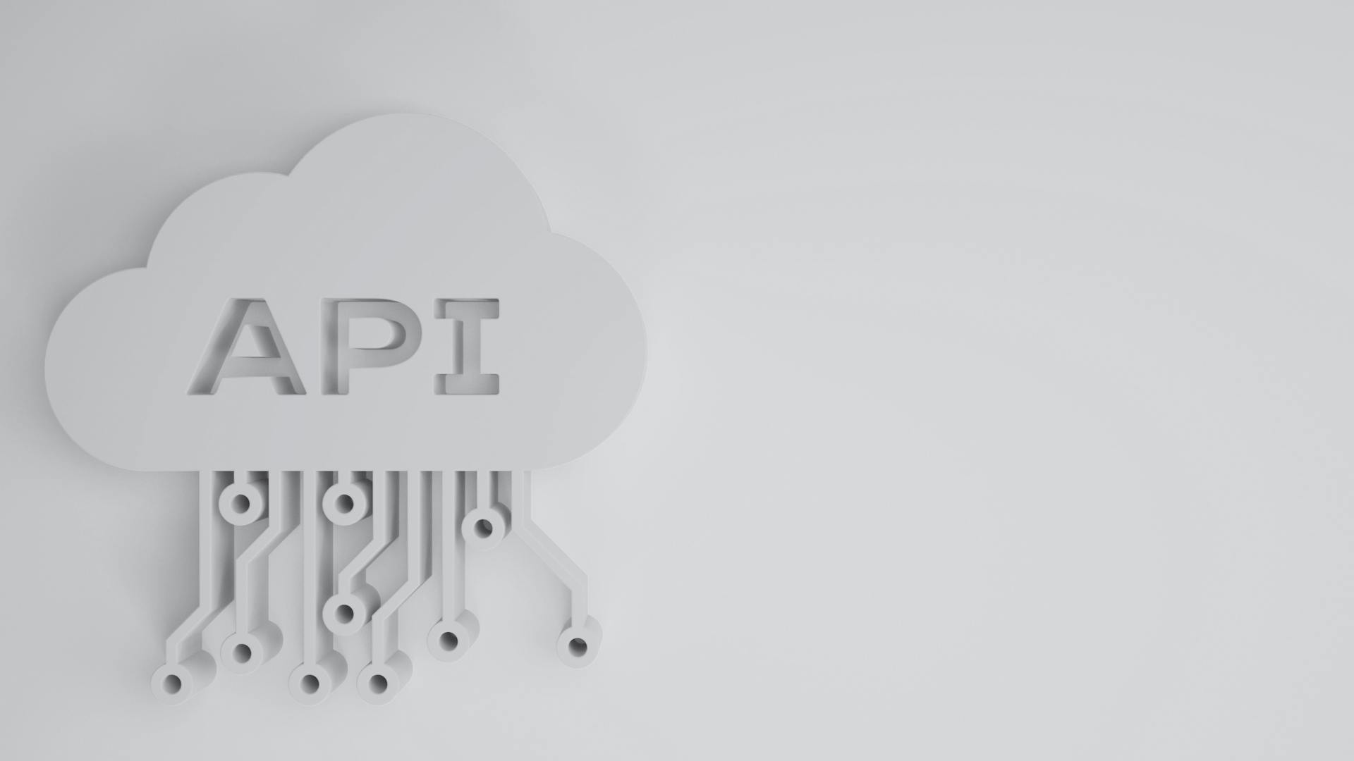 A 3D illustration of a cloud with the letters "API" in it. The cloud has several lines extending downward, each ending in a small circular knot. A 3D illustration of a cloud with the letters "API" in it. The cloud has several lines extending downward, each ending in a small circular knot.