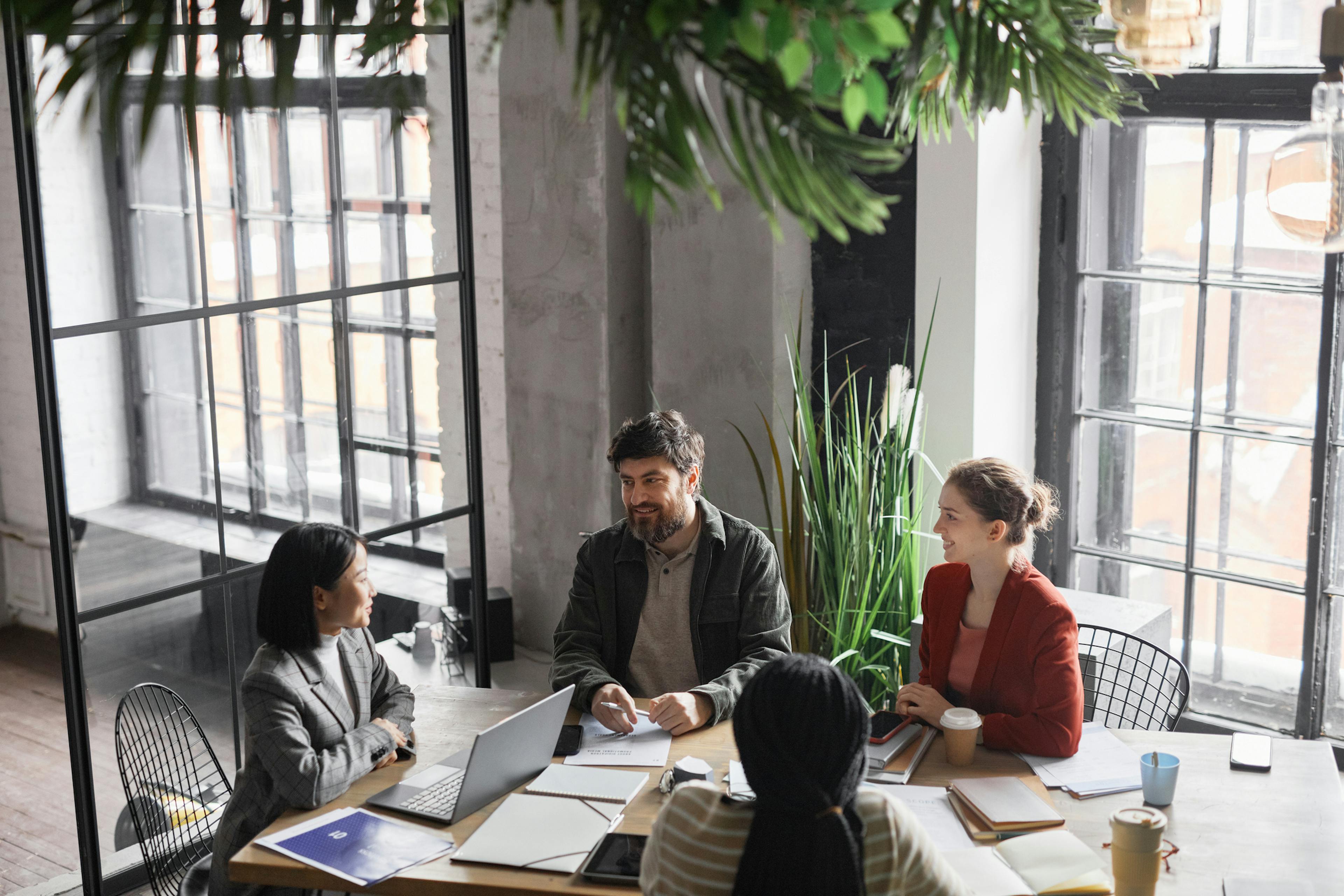 A meeting of executives ddressing how their organisation can shift into brand transparency.