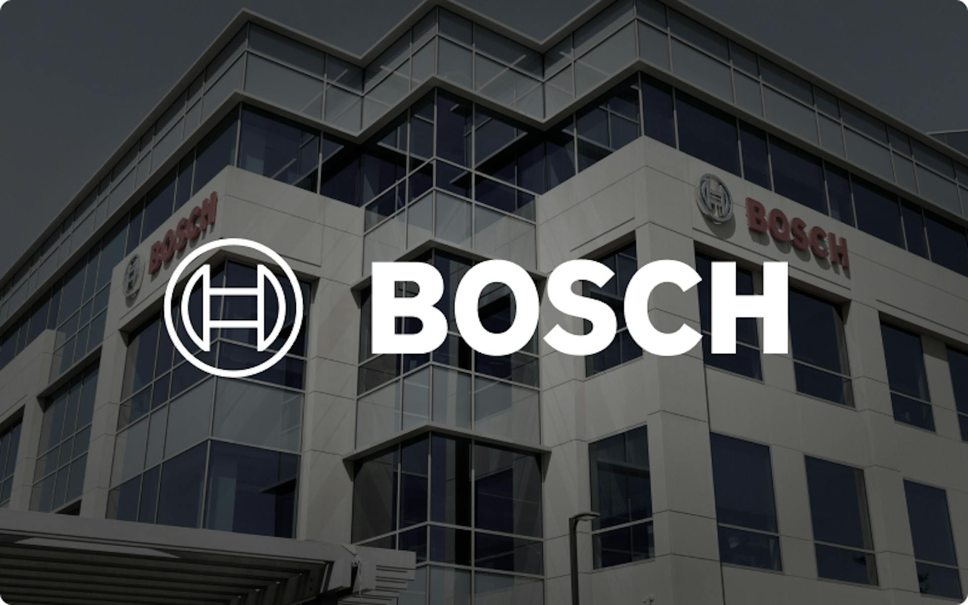 Bosch logo in white with a picture of the bosch offices in the background