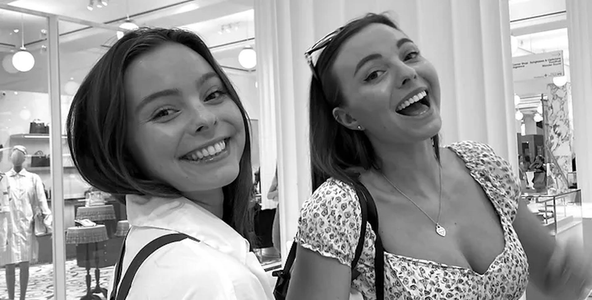 Two young female twins smiling and looking hoary 