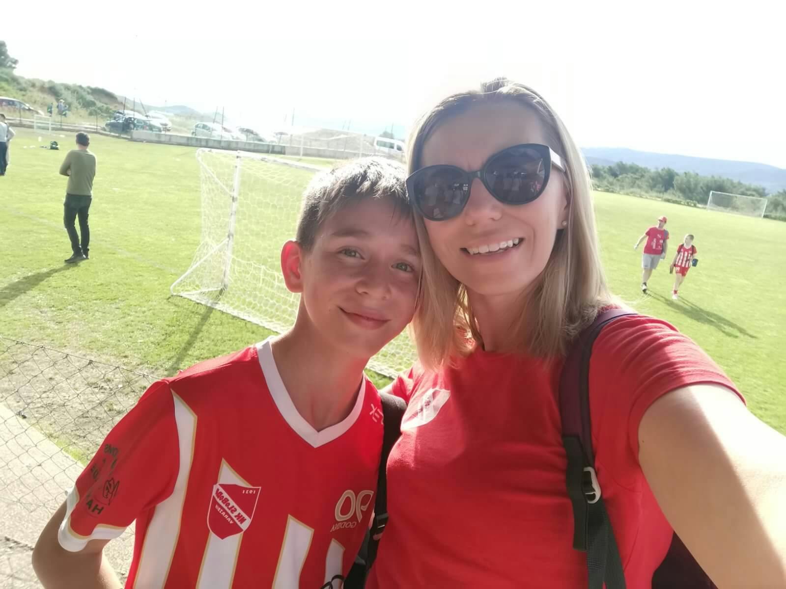 Ivana Ratkaj with her son at a football match