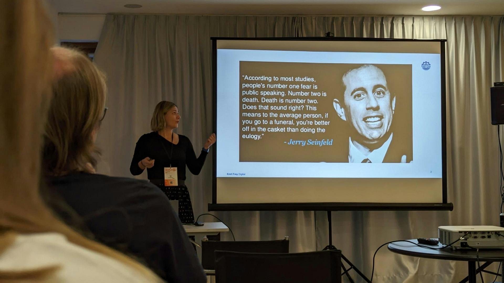 Natalia Jalušić showing a slide with a Jerry Seinfeld quote