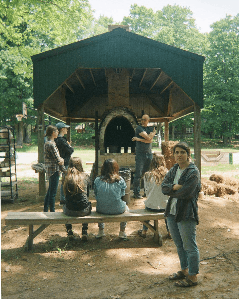 Students in front of a kiln