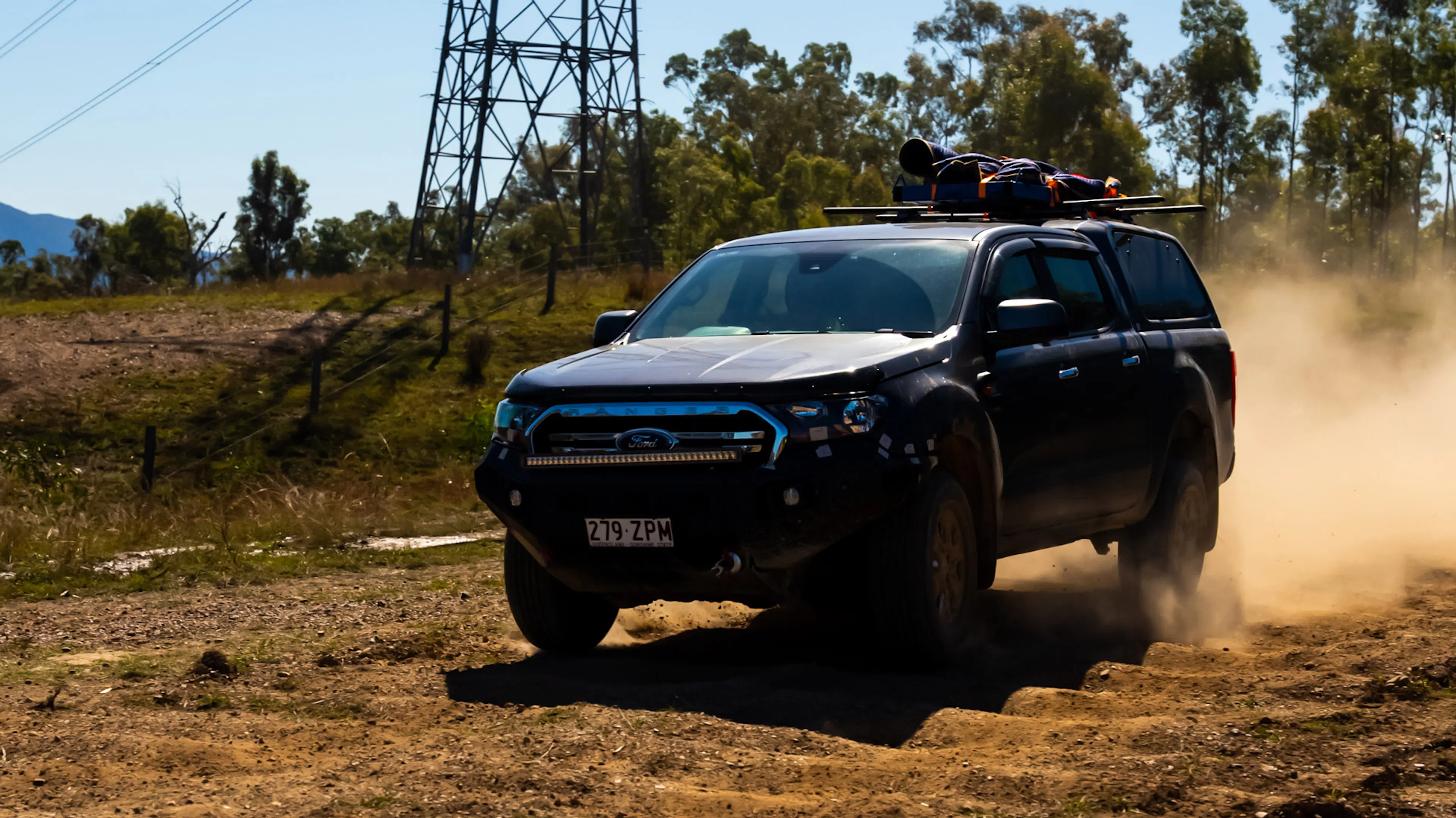 Truck with EGR accessories driving off-road in the outback