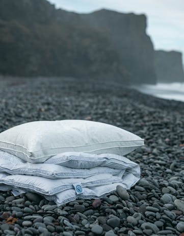Icelandic eiderdown duvet and pillow on beach