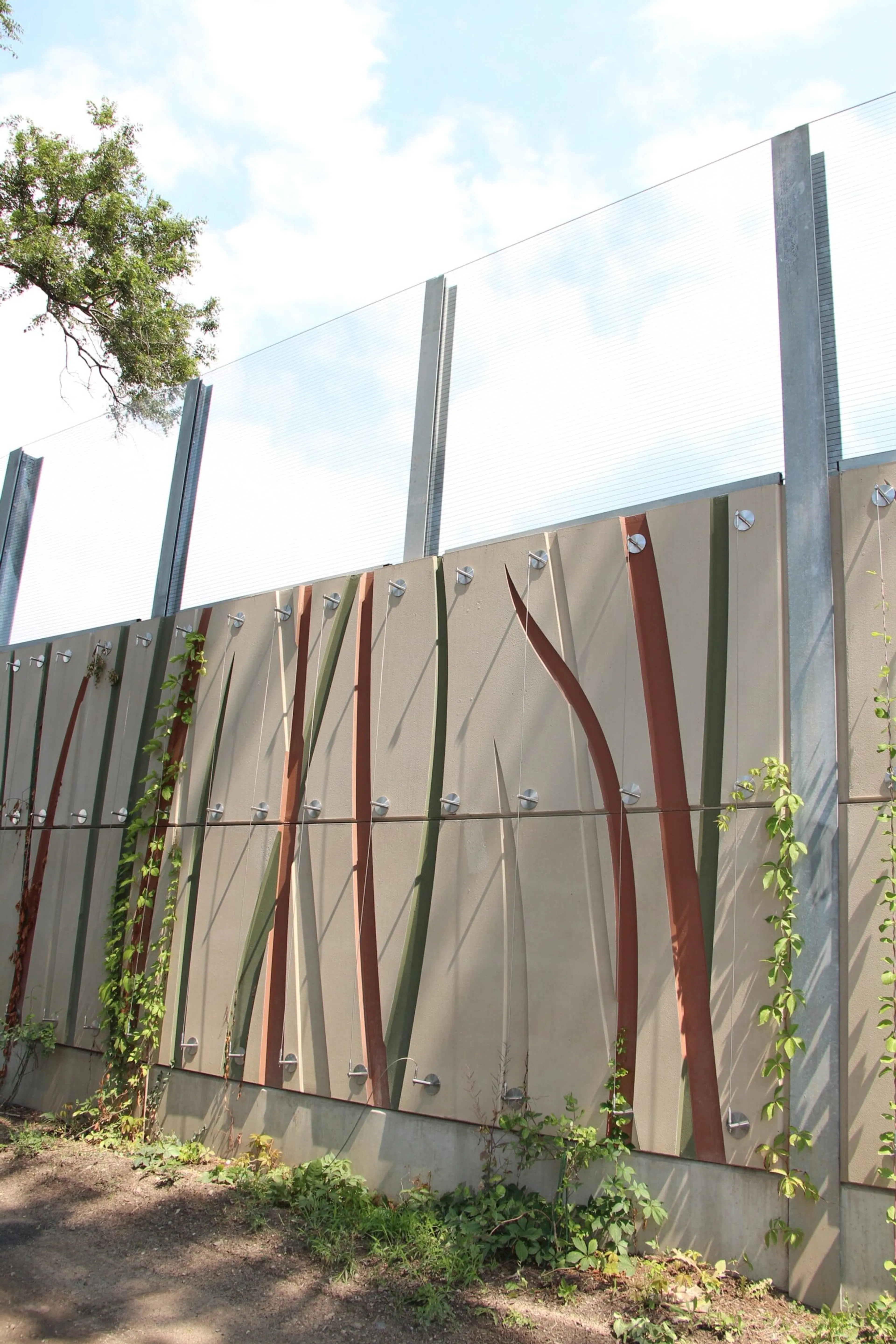 Reed-patterned wall panels in green and rust tones with vines climbing the base