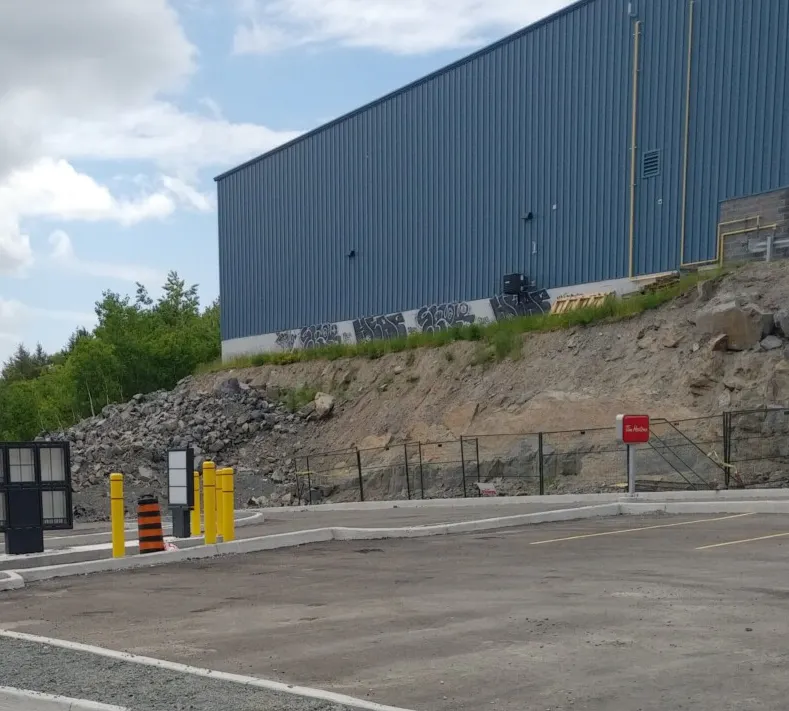 Large Block Mass Eliminates Geogrid at Commercial Site