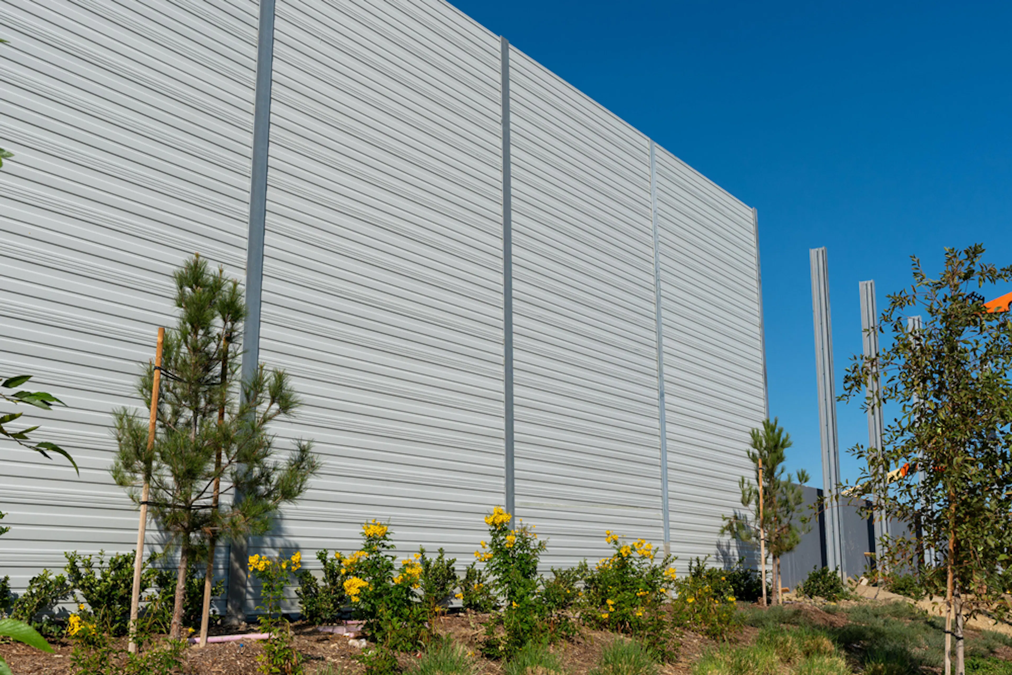 Tiered Wall Design Shields Homes from Freight Facility Noise