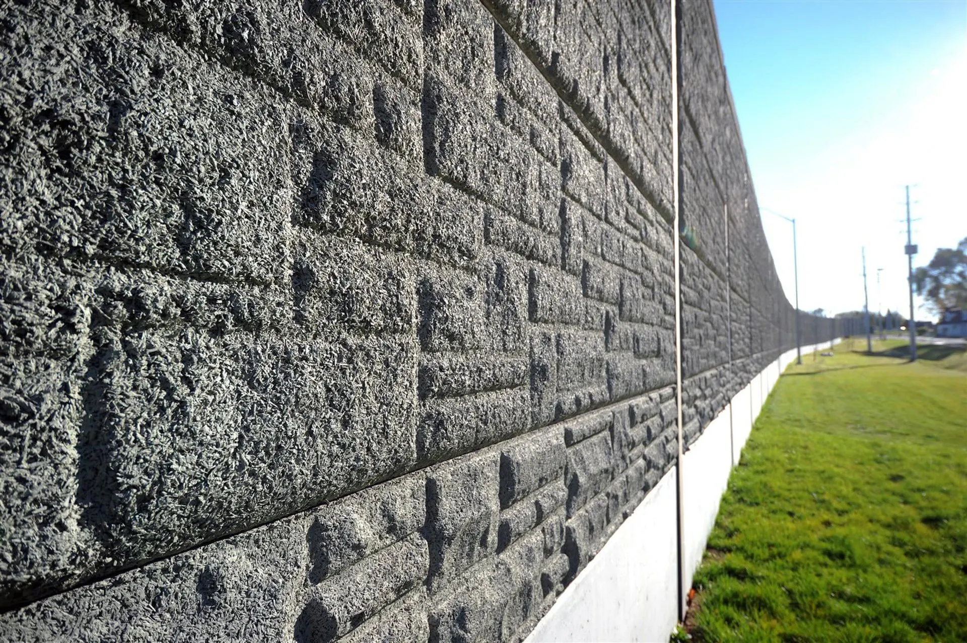 Close view along the deeply textured face of the absorptive perimeter wall