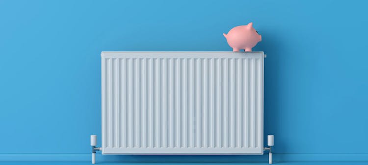 chauffage sur fond bleu avec une tirelire 