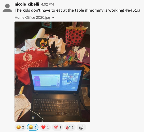 A screenshot showing a photo of a person's work from home set up. The caption reads "The kids don't have to eat at the table if mommy is working! #e451ia