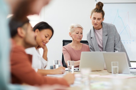 Counselor or professor working with student