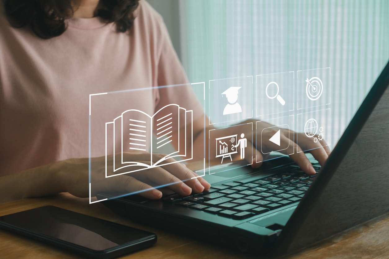 Woman using education software on a laptop