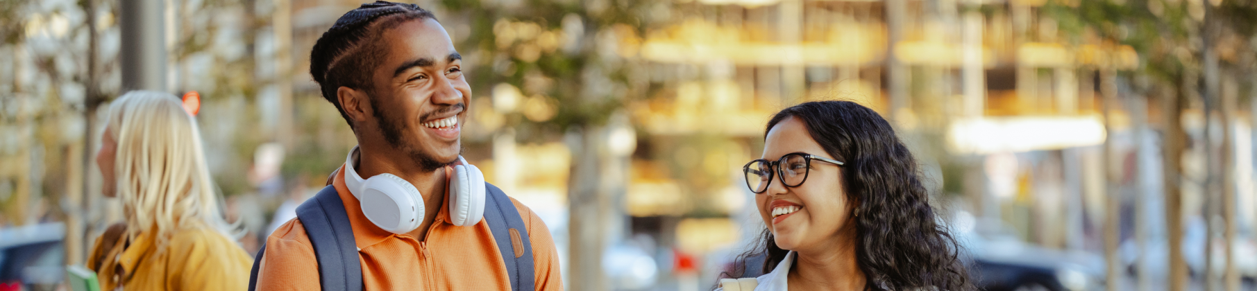 Two students walking to class together chatting.